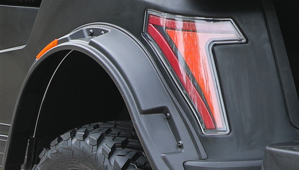 Wide Fender Flares for Protection and Rugged Style Close-up of durable, impact-resistant fender flares on an off-road e-cart.