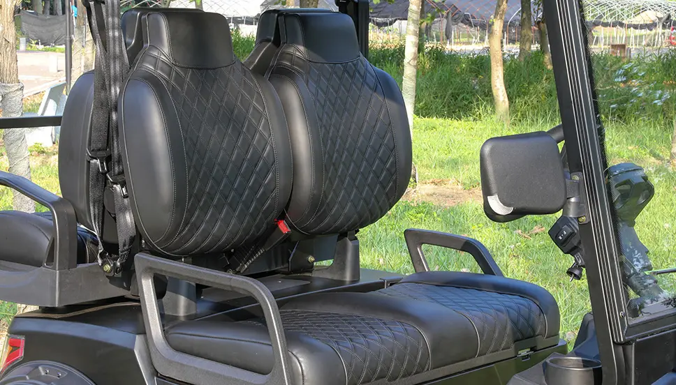 Comfortable and Stylish Seating for Adventure Close-up of plush, quilted black seats in an off-road e-cart.